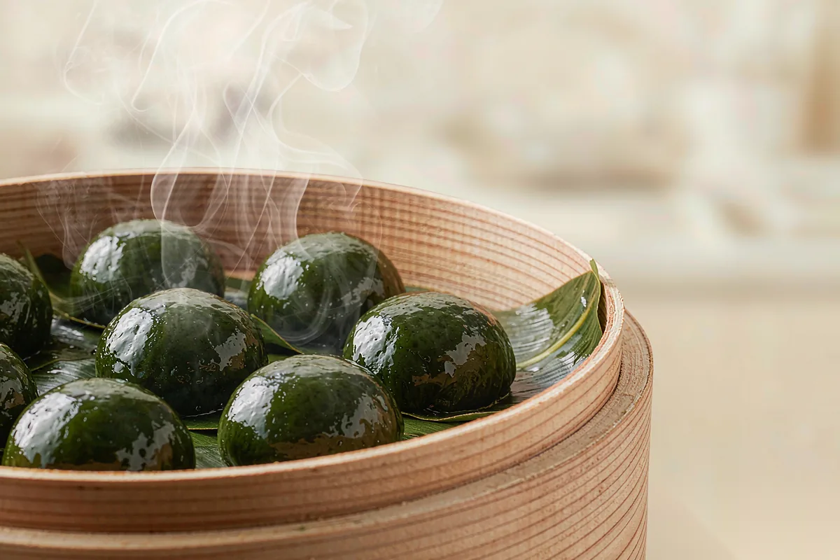 Qingtuan — green rice balls made with mugwort, eaten at Qingming.